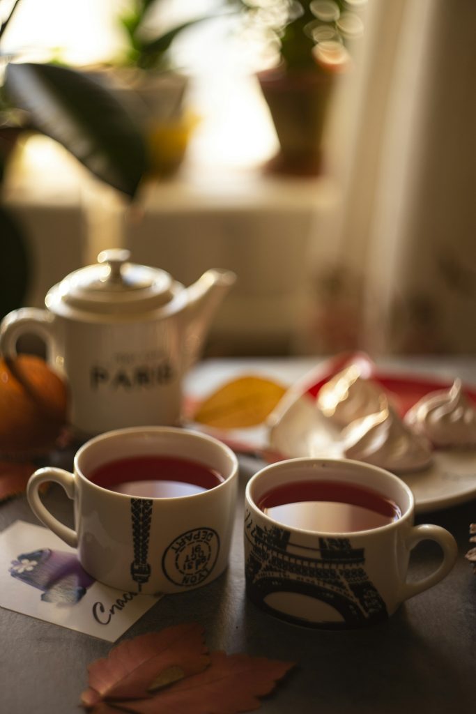 Two cups of tea on a table.