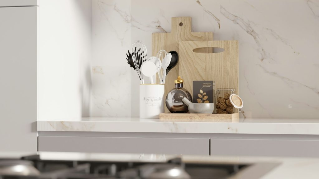 Kitchen worktop with cutting boards and utensils.